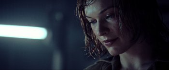 Movie still from “Resident Evil: Extinction” (2007), directed by Russell Mulcahy – A person with wet hair; Close Up shot, Over the shoulder angle