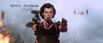 Movie still from “Resident Evil: Retribution” (2012), directed by Paul W.S. Anderson – A woman holding two guns in her hands; Medium shot, Low angle