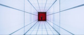 Movie still from “Resident Evil: Retribution” (2012), directed by Paul W.S. Anderson – A person standing in an empty room with a red light; Extreme Wide shot, Low angle