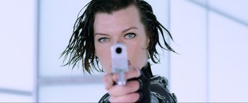 Movie still from “Resident Evil: Retribution” (2012), directed by Paul W.S. Anderson – A person holding a gun; Close Up shot, Low angle