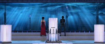 Movie still from “Resident Evil: Retribution” (2012), directed by Paul W.S. Anderson – Two women in black outfits standing in front of an aquarium; Wide shot, Low angle