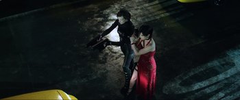 Movie still from “Resident Evil: Retribution” (2012), directed by Paul W.S. Anderson – A couple of women standing next to each other on the ground; Medium shot, High angle