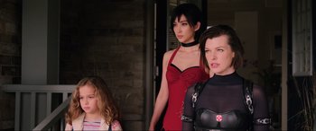 Movie still from “Resident Evil: Retribution” (2012), directed by Paul W.S. Anderson – A group of women standing next to each other; Medium shot, Over the shoulder angle