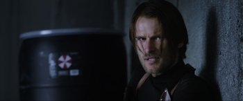 Movie still from “Resident Evil: Retribution” (2012), directed by Paul W.S. Anderson – A person with long hair; Close Up shot, Over the shoulder angle