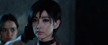 Movie still from “Resident Evil: Retribution” (2012), directed by Paul W.S. Anderson – A person wearing a red shirt; Close Up shot, Low angle