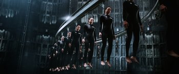 Movie still from “Resident Evil: Retribution” (2012), directed by Paul W.S. Anderson – A group of people in black wetsuits standing in a row; Wide shot, High angle