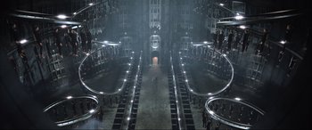 Movie still from “Resident Evil: Retribution” (2012), directed by Paul W.S. Anderson – A group of people standing in a large room; Extreme Wide shot, Overhead angle