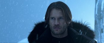 Movie still from “Resident Evil: Retribution” (2012), directed by Paul W.S. Anderson – A person with long hair; Close Up shot, Over the shoulder angle