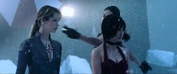 Movie still from “Resident Evil: Retribution” (2012), directed by Paul W.S. Anderson – A group of women standing next to each other in the snow; Medium shot, Over the shoulder angle
