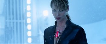 Movie still from “Resident Evil: Retribution” (2012), directed by Paul W.S. Anderson – A woman wearing a black jacket and a red necklace; Close Up shot, Over the shoulder angle