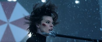 Movie still from “Resident Evil: Retribution” (2012), directed by Paul W.S. Anderson – A person holding a baseball bat; Close Up shot, Low angle