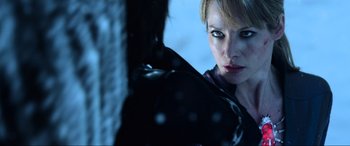 Movie still from “Resident Evil: Retribution” (2012), directed by Paul W.S. Anderson – A person wearing a black jacket; Close Up shot, Over the shoulder angle