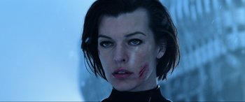 Movie still from “Resident Evil: Retribution” (2012), directed by Paul W.S. Anderson – A person with blood on their face; Close Up shot, Low angle