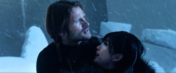 Movie still from “Resident Evil: Retribution” (2012), directed by Paul W.S. Anderson – A man and a woman in the snow; Close Up shot, Over the shoulder angle