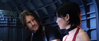 Movie still from “Resident Evil: Retribution” (2012), directed by Paul W.S. Anderson – A man and a woman are talking to each other; Close Up shot, Over the shoulder angle