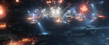 Movie still from “Resident Evil: Retribution” (2012), directed by Paul W.S. Anderson – An aerial view of an outdoor concert with lights and smoke; Extreme Wide shot, High angle