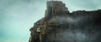 Movie still from “Resident Evil: The Final Chapter” (2016), directed by Paul W.S. Anderson – A cable car going up the side of a mountain; Extreme Wide shot, Low angle