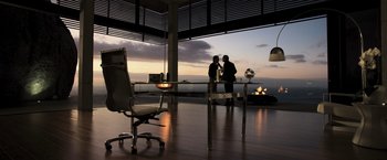 Movie still from “Resident Evil: The Final Chapter” (2016), directed by Paul W.S. Anderson – Two men are talking in an office at sunset; Wide shot, High angle