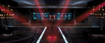 Movie still from “Resident Evil: The Final Chapter” (2016), directed by Paul W.S. Anderson – A man standing in front of a television set; Extreme Wide shot, High angle