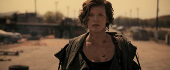 Movie still from “Resident Evil: The Final Chapter” (2016), directed by Paul W.S. Anderson – A person wearing a black shirt; Close Up shot, Low angle