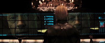 Movie still from “Resident Evil: The Final Chapter” (2016), directed by Paul W.S. Anderson – A man in a black leather jacket looking at a screen; Close Up shot, Over the shoulder angle