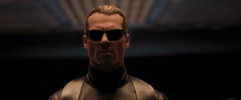 Movie still from “Resident Evil: The Final Chapter” (2016), directed by Paul W.S. Anderson – A person wearing sunglasses; Close Up shot, Low angle