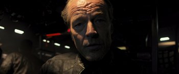 Movie still from “Resident Evil: The Final Chapter” (2016), directed by Paul W.S. Anderson – A person wearing a leather jacket; Close Up shot, Low angle