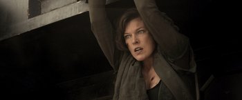 Movie still from “Resident Evil: The Final Chapter” (2016), directed by Paul W.S. Anderson – A woman with her head hanging in the air; Close Up shot, Low angle