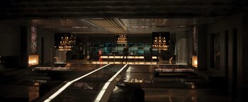 Movie still from “Resident Evil: The Final Chapter” (2016), directed by Paul W.S. Anderson – A man and a woman standing in front of a bar; Extreme Wide shot, High angle