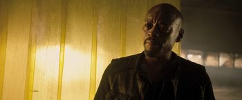 Movie still from “Resident Evil: The Final Chapter” (2016), directed by Paul W.S. Anderson – A person wearing a jacket; Close Up shot, Low angle