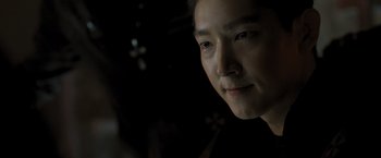 Movie still from “Resident Evil: The Final Chapter” (2016), directed by Paul W.S. Anderson – A person's face in the dark; Close Up shot, Over the shoulder angle