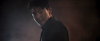 Movie still from “Resident Evil: The Final Chapter” (2016), directed by Paul W.S. Anderson – A person wearing a black shirt; Close Up shot, Over the shoulder angle