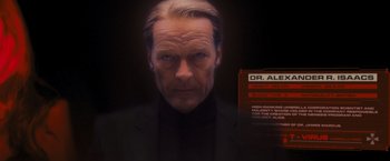 Movie still from “Resident Evil: The Final Chapter” (2016), directed by Paul W.S. Anderson – A person wearing a suit and tie; Close Up shot, Low angle