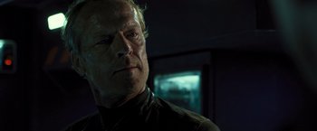 Movie still from “Resident Evil: The Final Chapter” (2016), directed by Paul W.S. Anderson – A person wearing a black shirt; Close Up shot, Over the shoulder angle