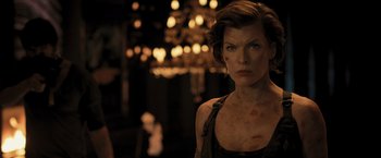 Movie still from “Resident Evil: The Final Chapter” (2016), directed by Paul W.S. Anderson – Milla jovovich in resident evil : the final chapter; Close Up shot, Over the shoulder angle