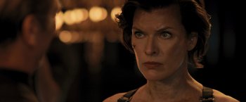 Movie still from “Resident Evil: The Final Chapter” (2016), directed by Paul W.S. Anderson – A person with short dark hair; Close Up shot, Low angle