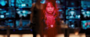 Movie still from “Resident Evil: The Final Chapter” (2016), directed by Paul W.S. Anderson – A young girl is standing in a room with lights in the background; Close Up shot, Over the shoulder angle