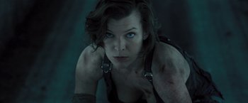 Movie still from “Resident Evil: The Final Chapter” (2016), directed by Paul W.S. Anderson – A person laying on the ground; Close Up shot, Low angle
