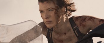 Movie still from “Resident Evil: The Final Chapter” (2016), directed by Paul W.S. Anderson – A person holding a sword; Close Up shot, Low angle