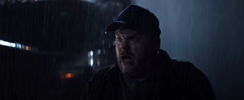 Movie still from “Resident Evil: Welcome to Raccoon City” (2021), directed by Johannes Roberts – A person wearing a hat and a jacket; Close Up shot, Low angle