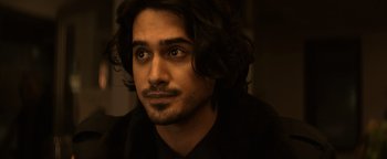 Movie still from “Resident Evil: Welcome to Raccoon City” (2021), directed by Johannes Roberts – A person with long hair; Close Up shot, Over the shoulder angle