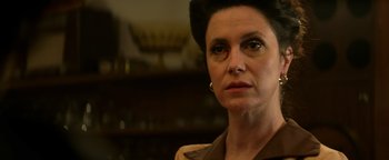 Movie still from “Resident Evil: Welcome to Raccoon City” (2021), directed by Johannes Roberts – A person wearing a brown shirt; Close Up shot, Low angle