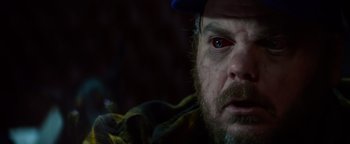 Movie still from “Resident Evil: Welcome to Raccoon City” (2021), directed by Johannes Roberts – A person wearing a hat; Close Up shot, High angle