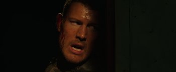 Movie still from “Resident Evil: Welcome to Raccoon City” (2021), directed by Johannes Roberts – A person with blood on his face; Close Up shot, High angle