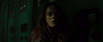 Movie still from “Resident Evil: Welcome to Raccoon City” (2021), directed by Johannes Roberts – A person wearing a red jacket; Close Up shot, Low angle