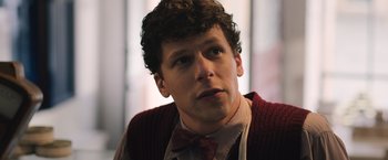 Movie still from “Resistance” (2020), directed by Jonathan Jakubowicz – A person wearing a bow tie; Close Up shot, Low angle