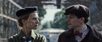 Movie still from “Resistance” (2020), directed by Jonathan Jakubowicz – A man and a woman standing next to each other on the street; Close Up shot, Low angle