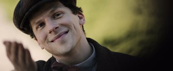 Movie still from “Resistance” (2020), directed by Jonathan Jakubowicz – A person wearing a bow tie; Close Up shot, High angle