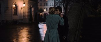Movie still from “Resistance” (2020), directed by Jonathan Jakubowicz – A man and a woman kissing in the dark; Medium shot, Over the shoulder angle
