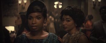 Movie still from “Respect” (2021), directed by Liesl Tommy – Two women standing next to each other in front of a crowd; Close Up shot, Over the shoulder angle